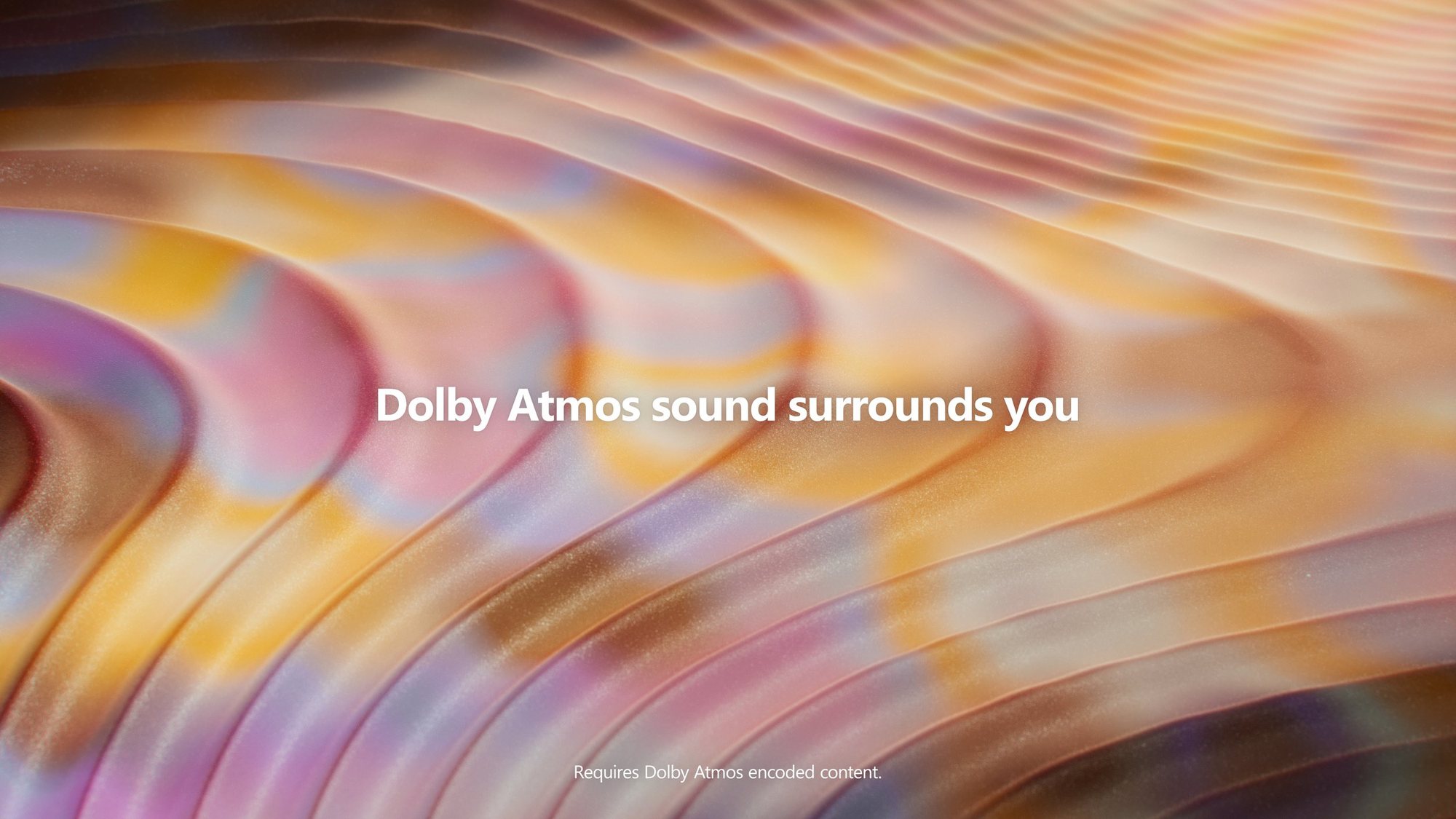Waves of color carrying the line Dolby Atmos sound surrounds you