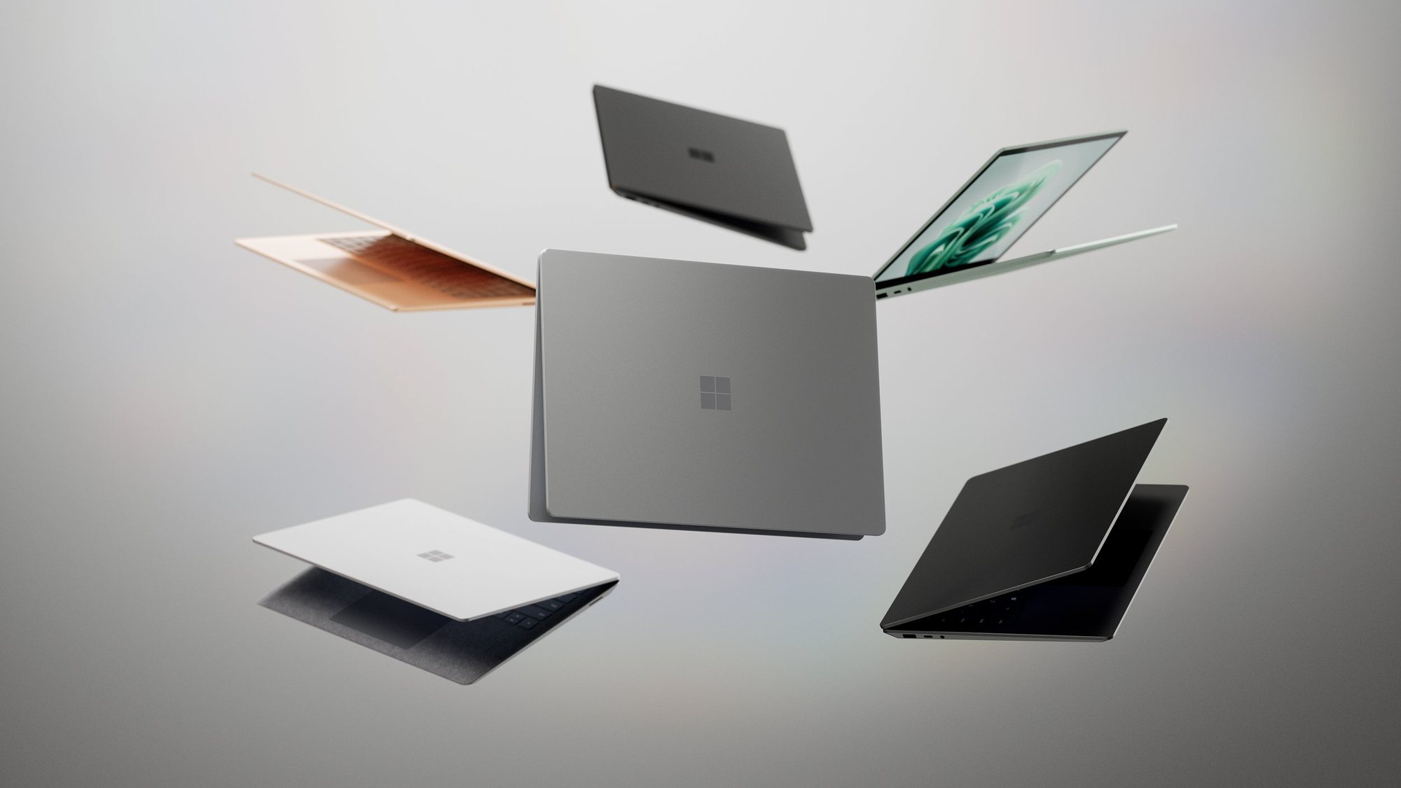 Surface laptops floating in a soft grey space, from the launch film